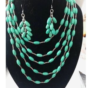 Multi-strand faux turquoise-style beaded necklace and earring set.Bohemian style